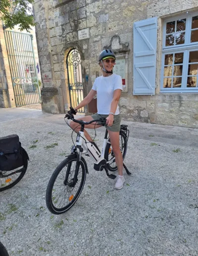 A woman on a bike, trying to relax at a retreat